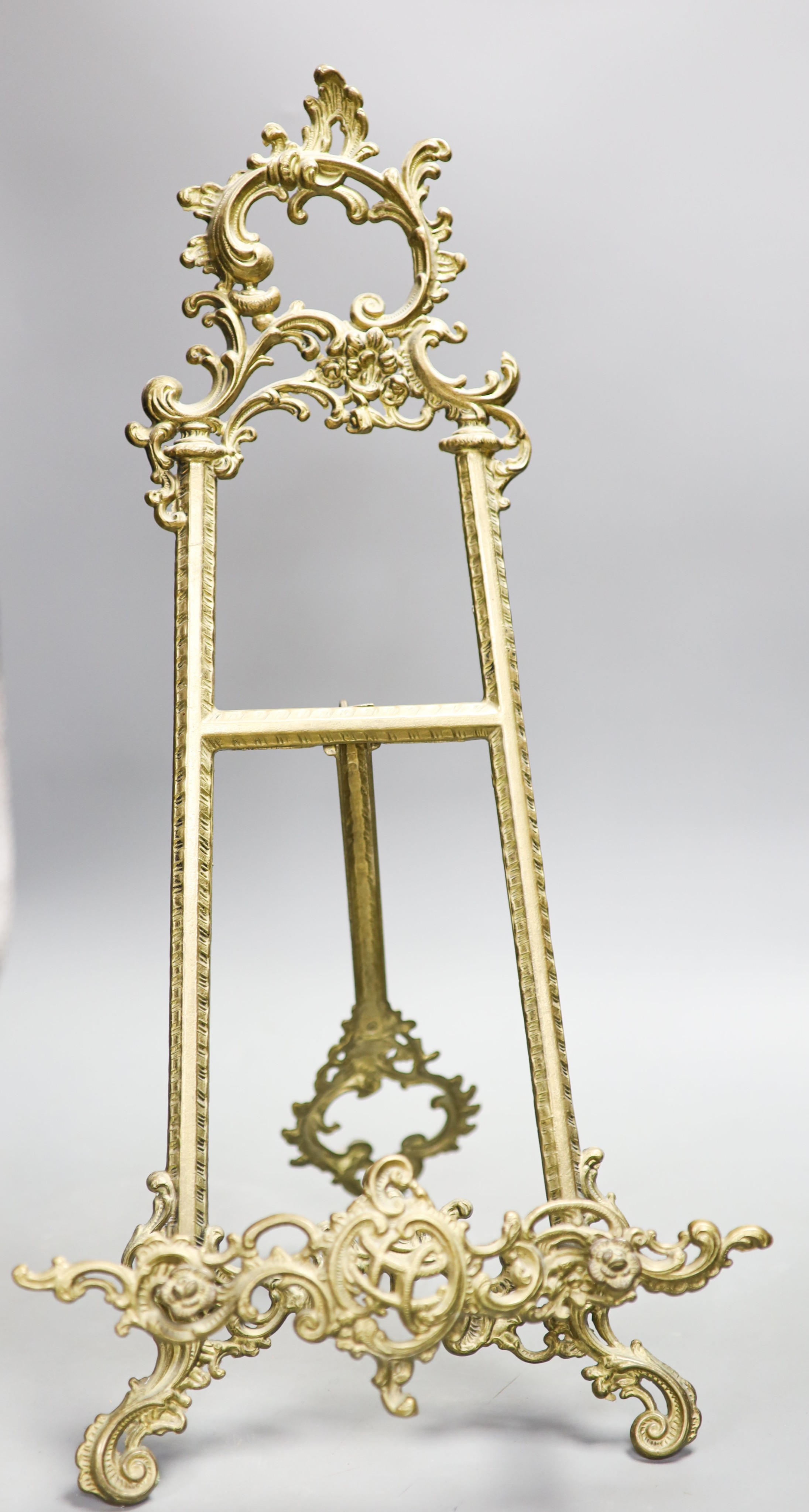 A cast brass easel 55cm